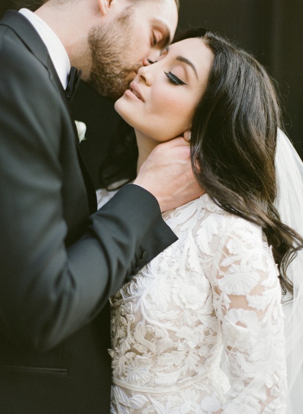 Groom Kissing Bride at their Elegant Wedding